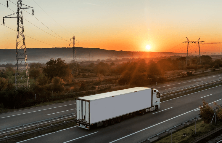 A haulage truck driving into the sunset, reflecting the industry's journey
towards embracing advanced technology, sustainability, and improved efficiency to
overcome outdated mindsets.